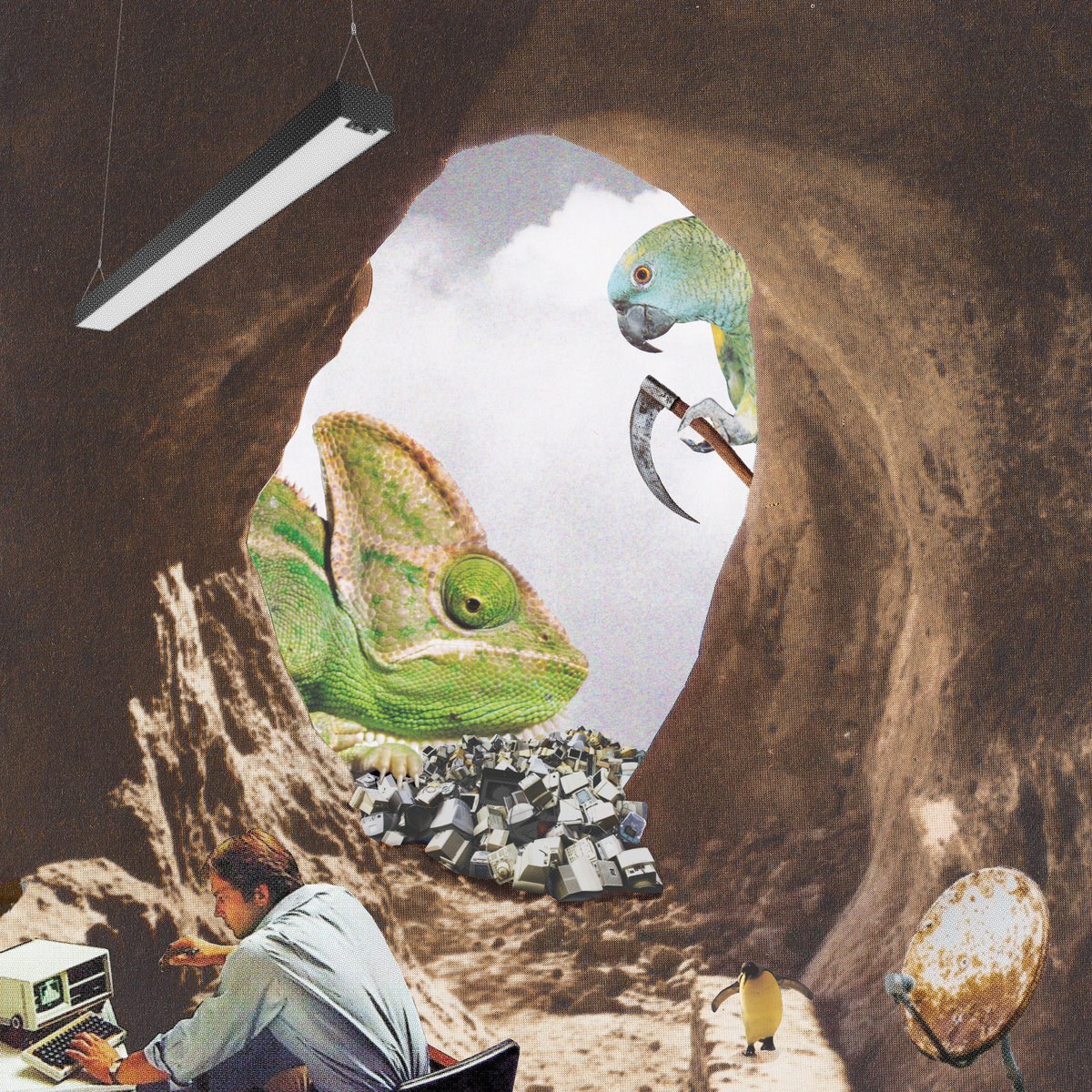 A surreal cave collage with a chameleon, parrot, penguin, computer equipment and a person at a desk.