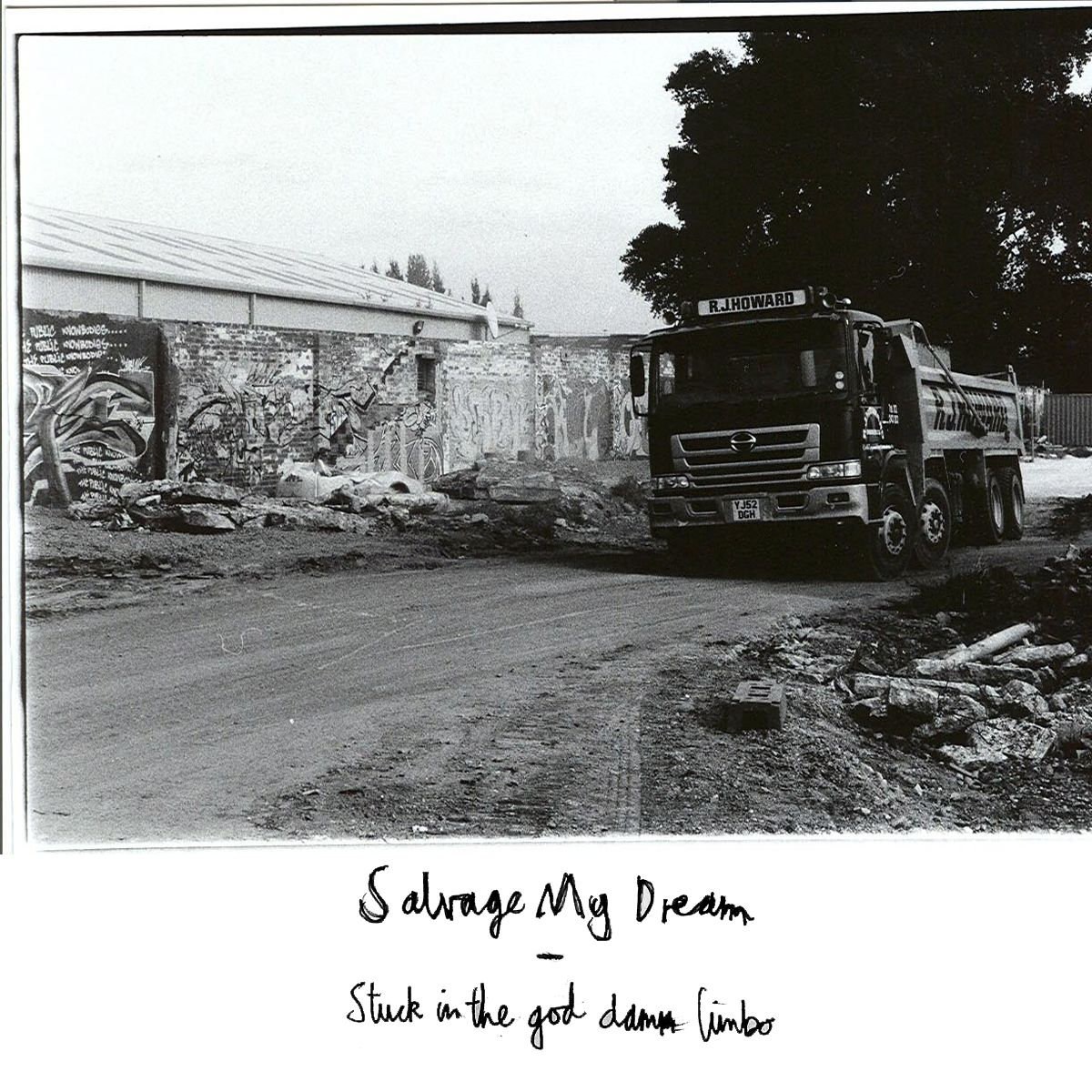Stuck in the God Damn Limbo cover showing a black-and-white industrial yard and truck.
